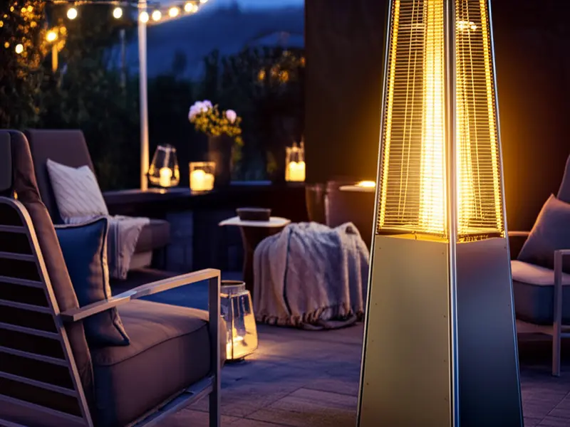 A serene patio scene with people enjoying a quiet evening, illuminated by soft lighting and a subtle, modern pellet patio heater.